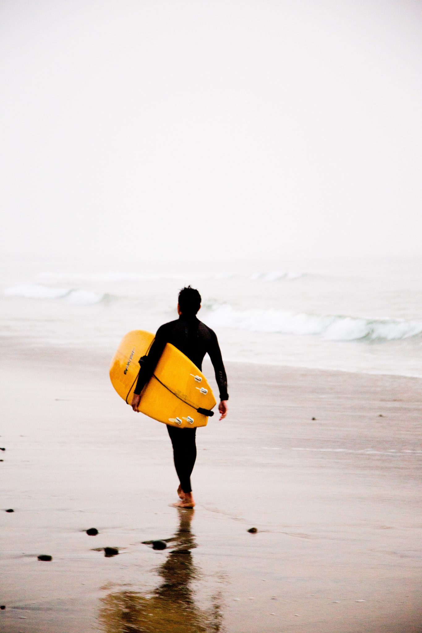 Man carrying surf board