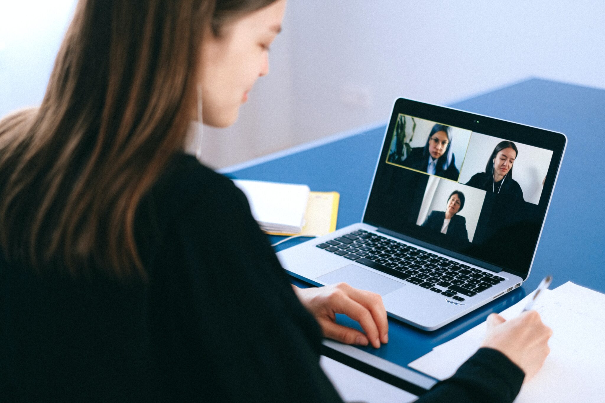 Woman attending a video meeting on her laptop.